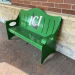 Green metal bench.