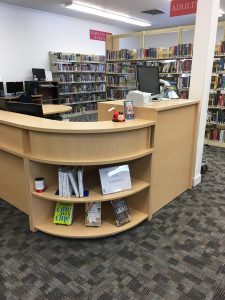 curved desk side with shelves